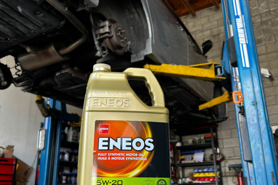 ENEOS 5w-20 oil sitting on tire