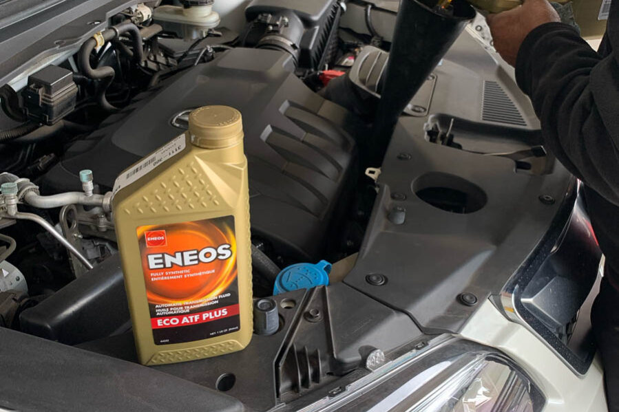 ENEOS motor oil sitting on car engine