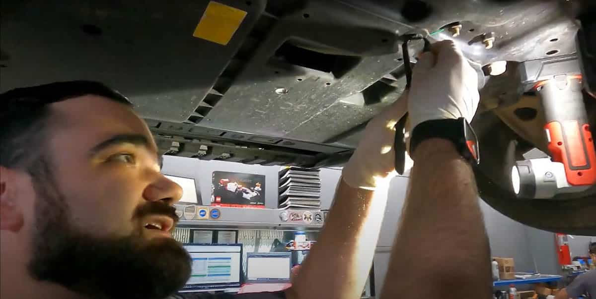 Tommy removing under panel clips of Nissan Altima