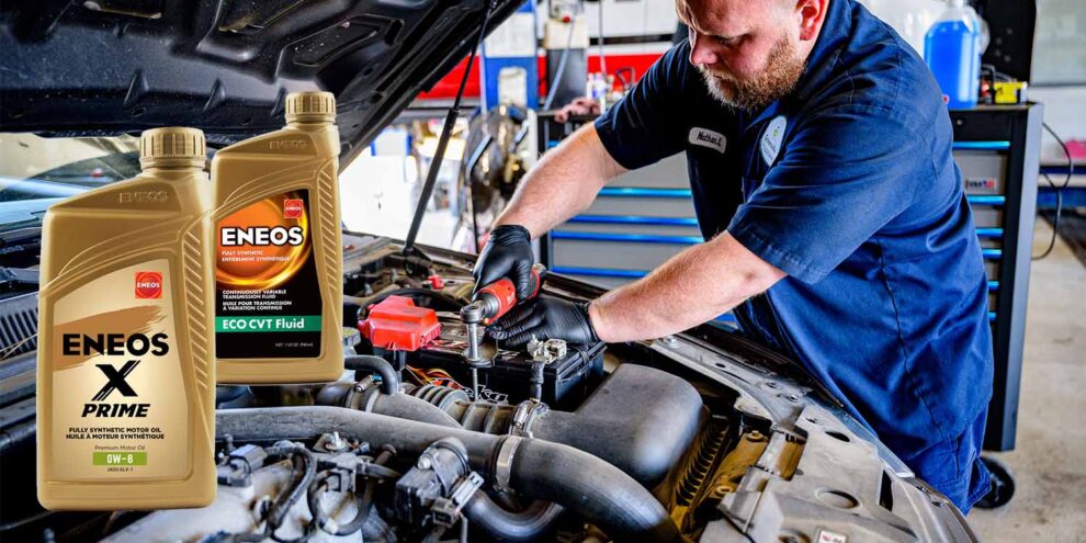 mechanic under hood with ENEOS products
